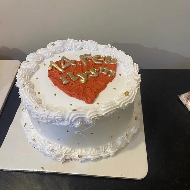 Valentine's love cake with red heart on top and 14 Feb ILYSM message - Love Celebration Cakes Karachi By Whisk And Sift
